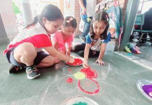 Students of Class One Making Rangoli 2