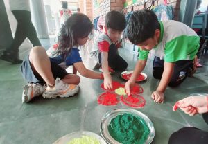 Students of Class One Making Rangoli